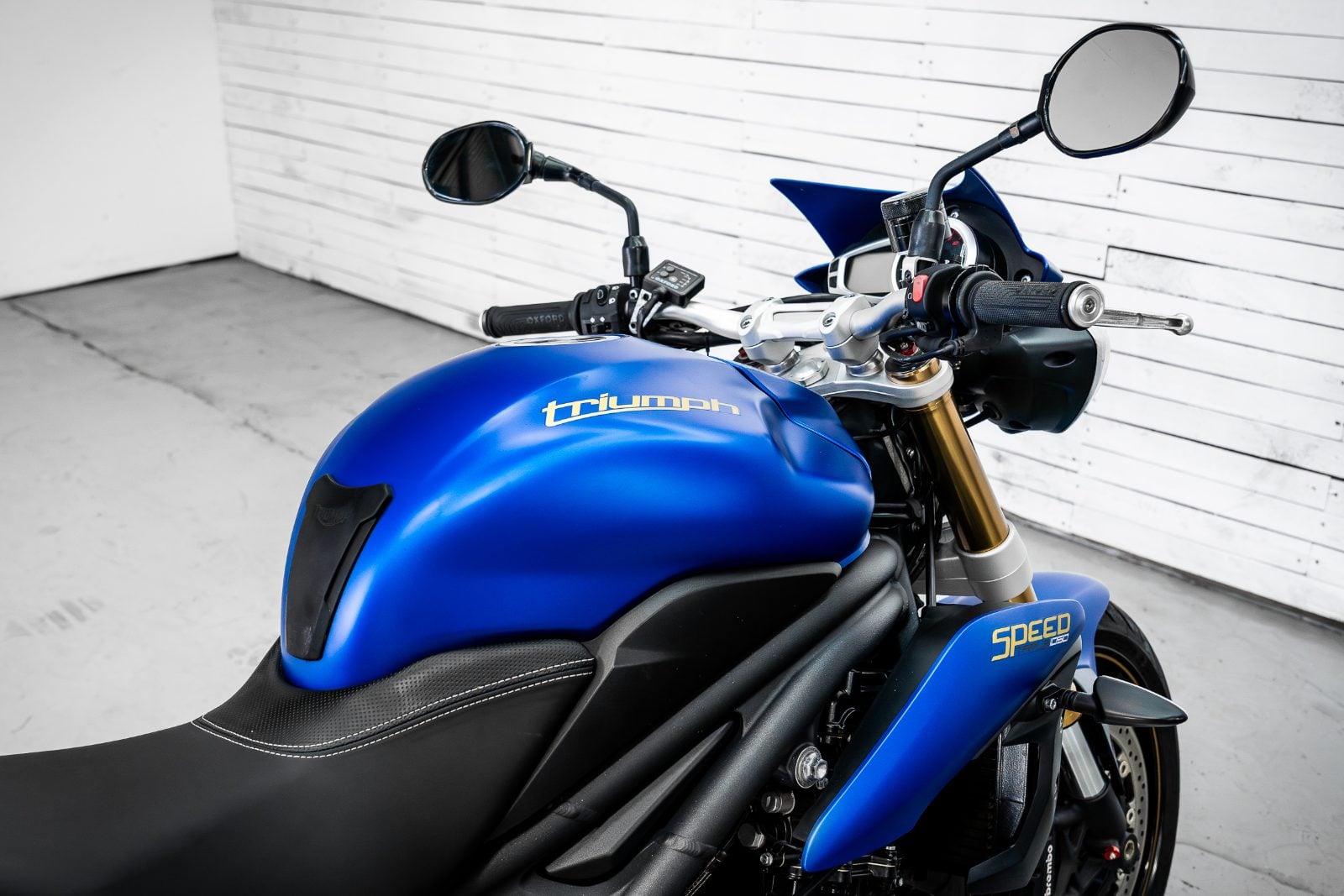 2014 Triumph Speed Triple 1050 ABS in Satin Blue - front three-quarter view