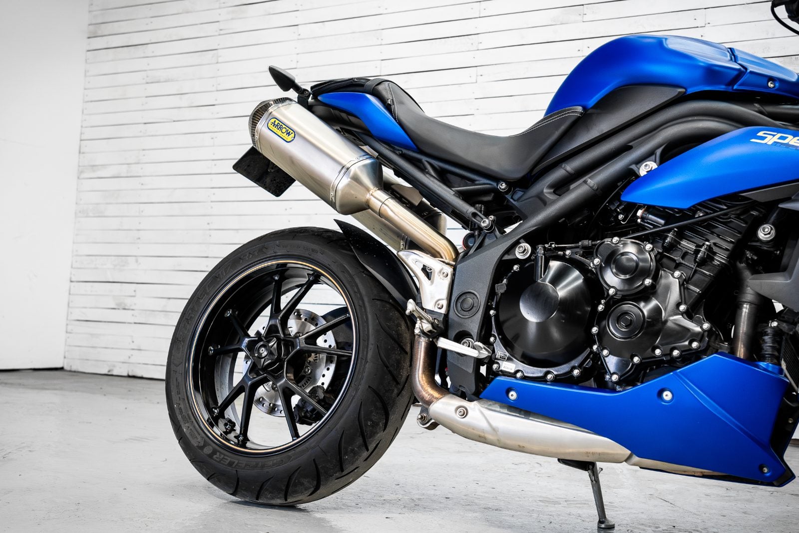2014 Triumph Speed Triple 1050 ABS in Satin Blue - rear wheel and engine