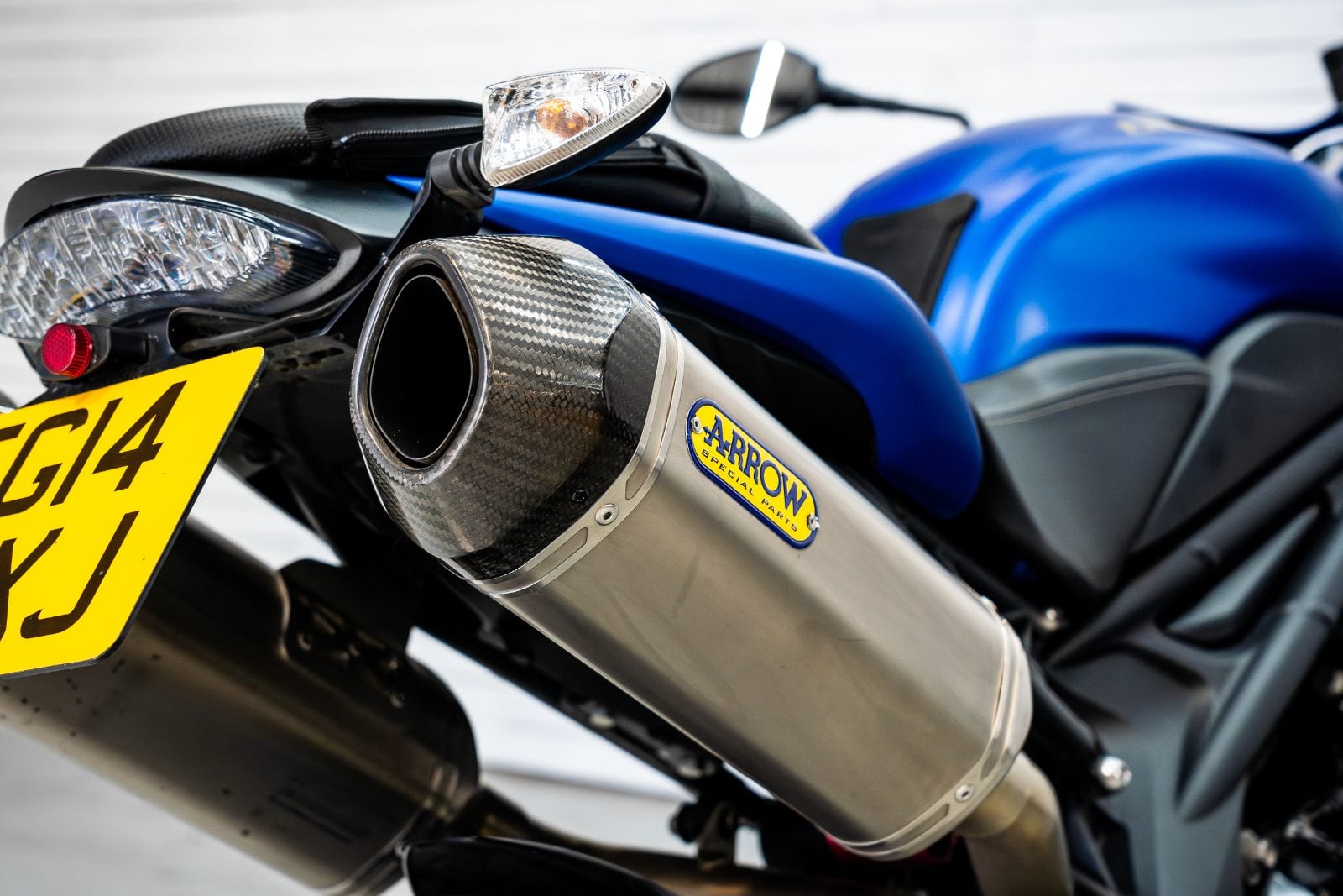 2014 Triumph Speed Triple 1050 ABS in Satin Blue - Arrow exhaust tip detail