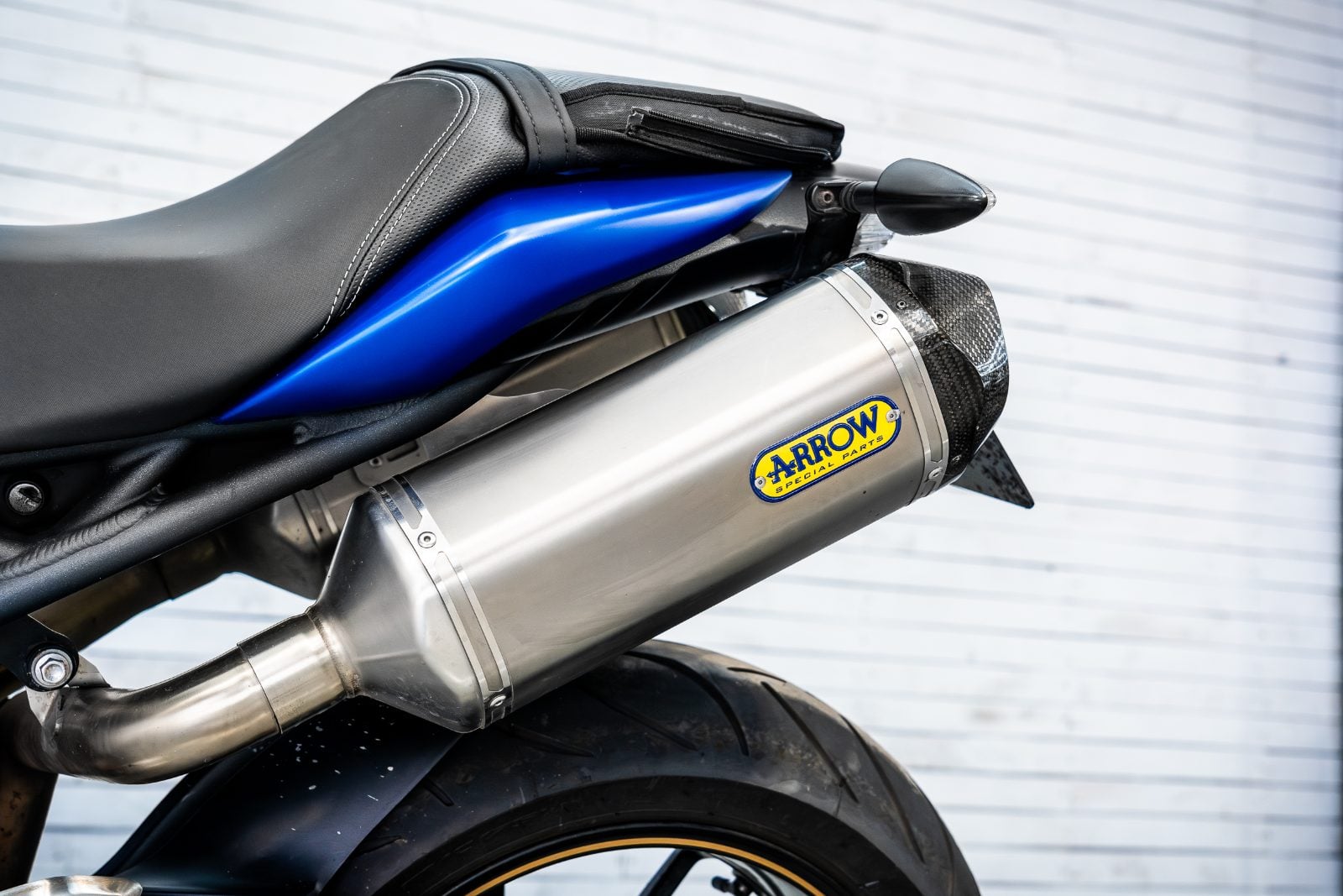 2014 Triumph Speed Triple 1050 ABS in Satin Blue - seat and Arrow exhaust