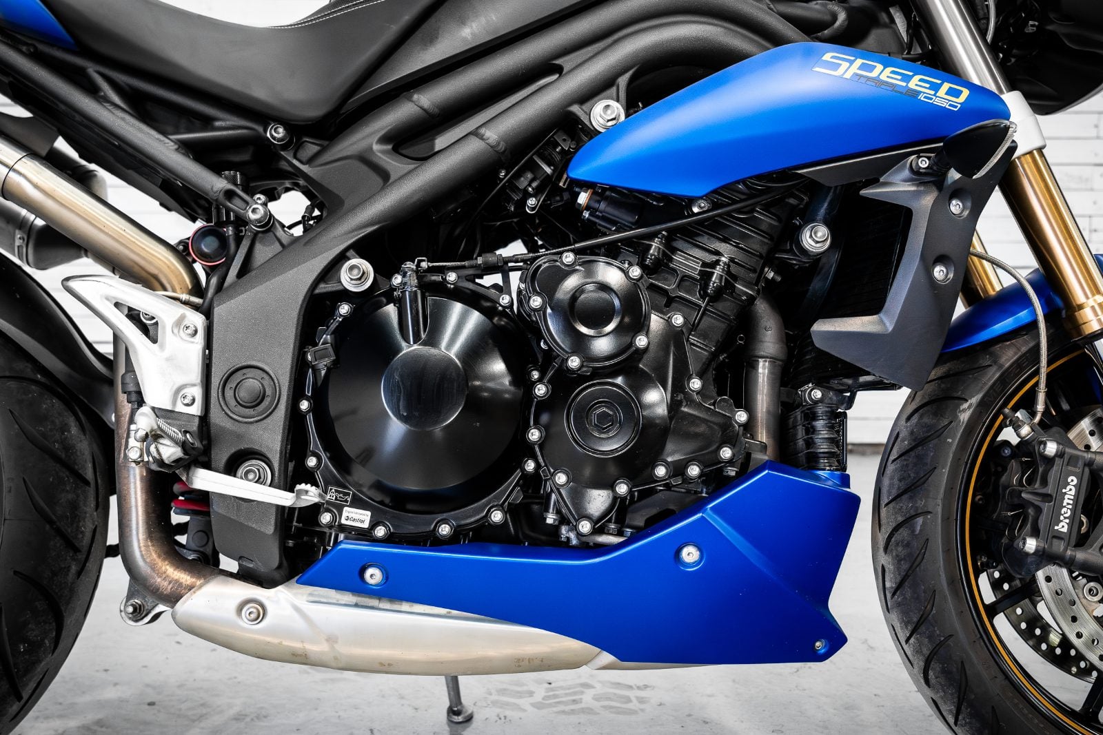2014 Triumph Speed Triple 1050 ABS in Satin Blue - engine and belly pan