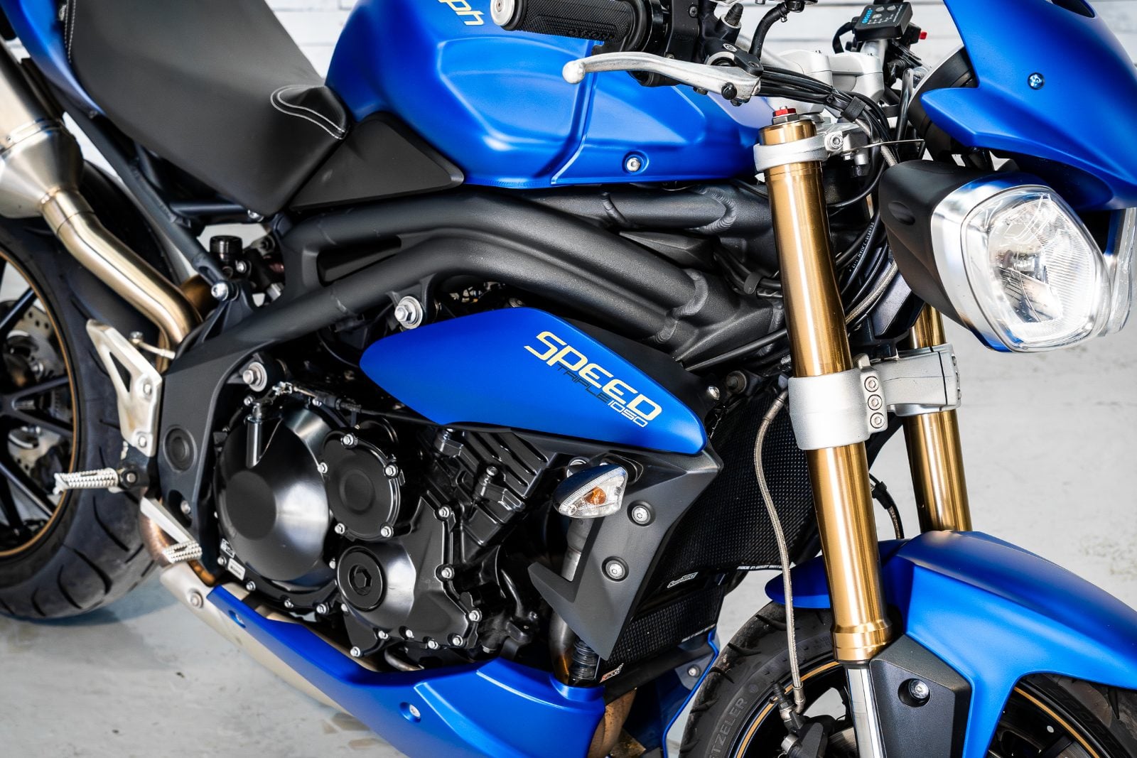 2014 Triumph Speed Triple 1050 ABS in Satin Blue - front right side view
