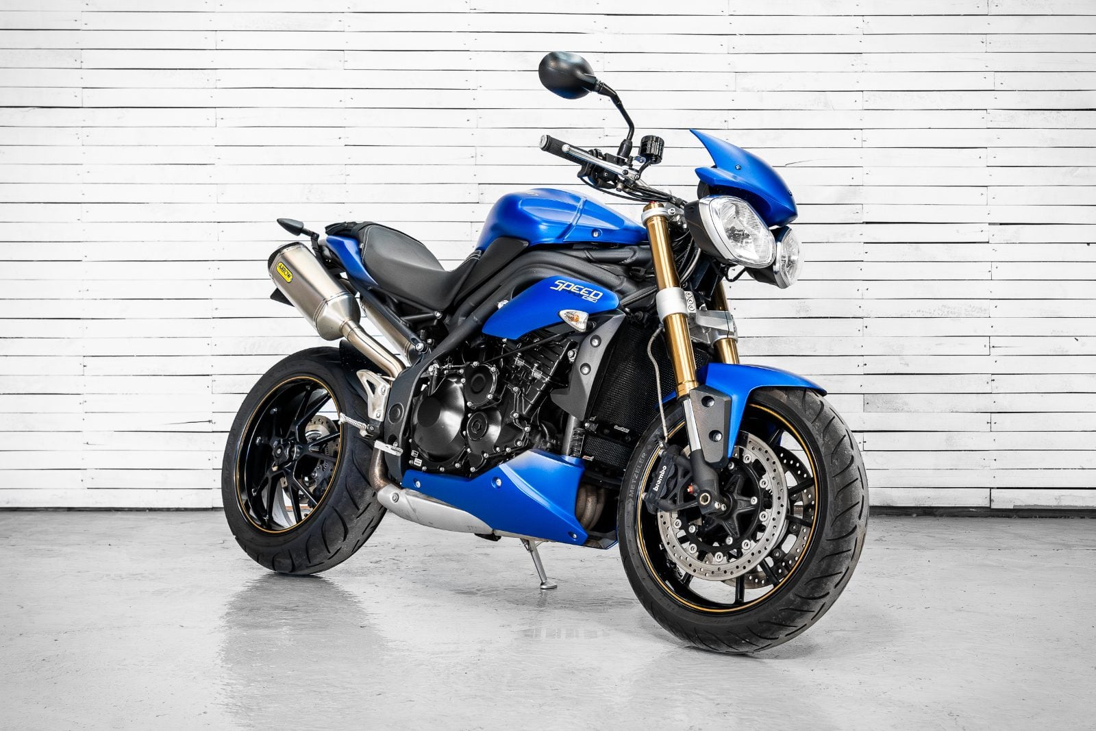 2014 Triumph Speed Triple 1050 ABS in Satin Blue - front three-quarter right