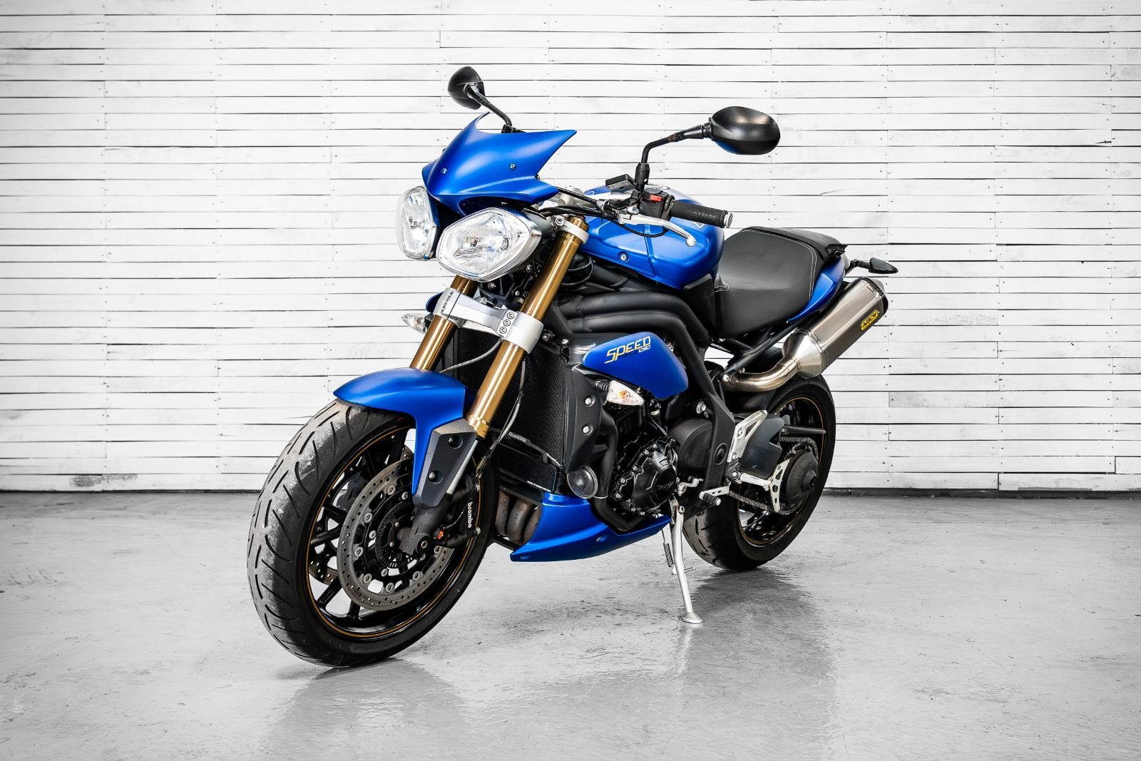 2014 Triumph Speed Triple 1050 ABS in Satin Blue - front three-quarter left