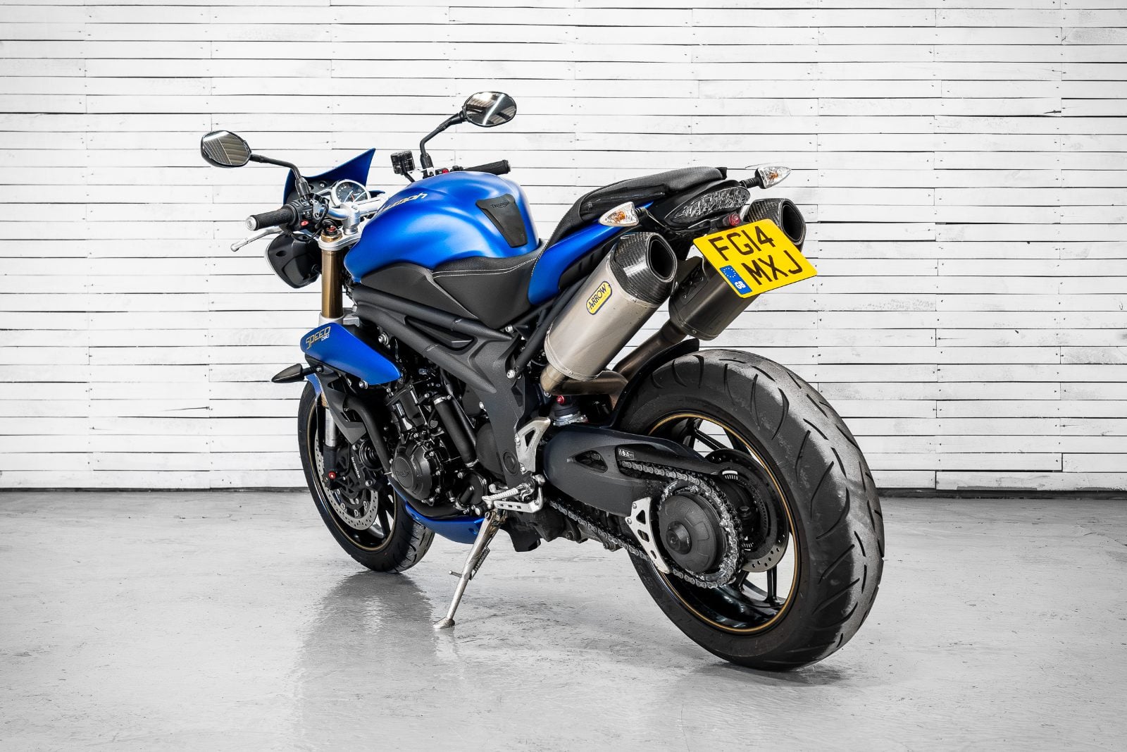 2014 Triumph Speed Triple 1050 ABS in Satin Blue - rear three-quarter left