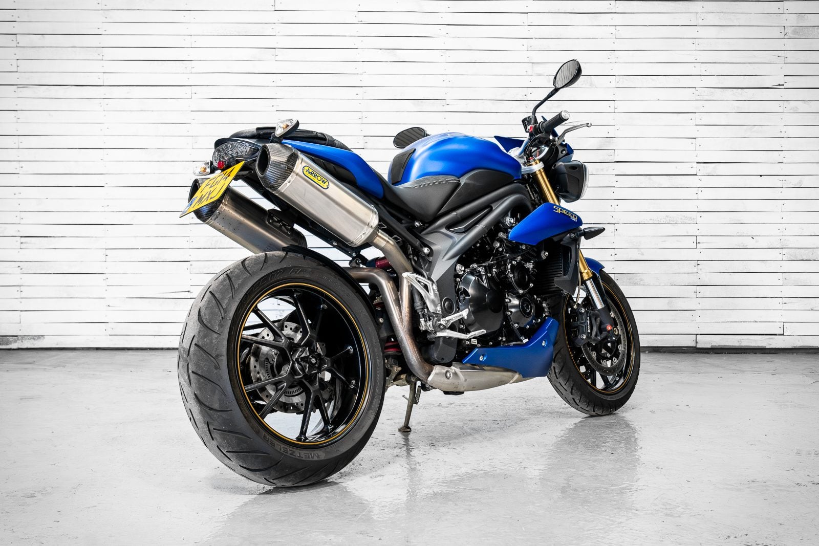 2014 Triumph Speed Triple 1050 ABS in Satin Blue - rear three-quarter right
