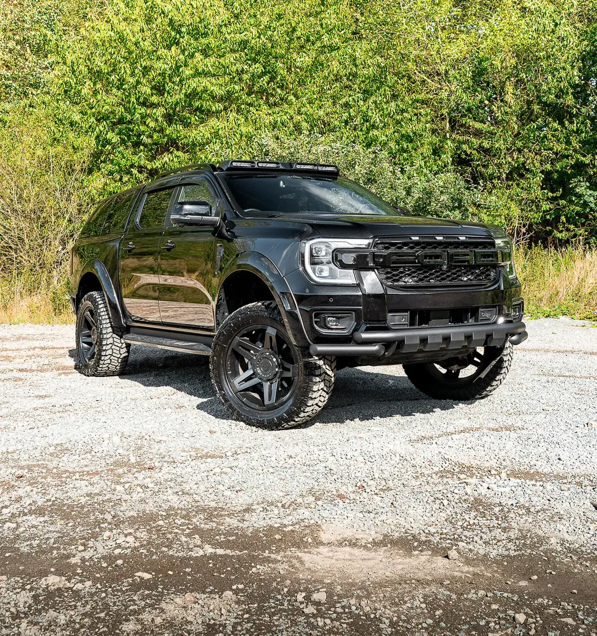 Black Ford Ranger with wide arch body kit and 35 inch tyres