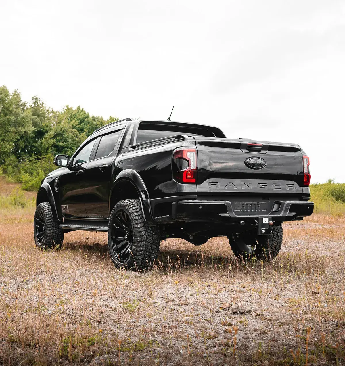 Modified Ford Ranger rear quarter view with lift kit