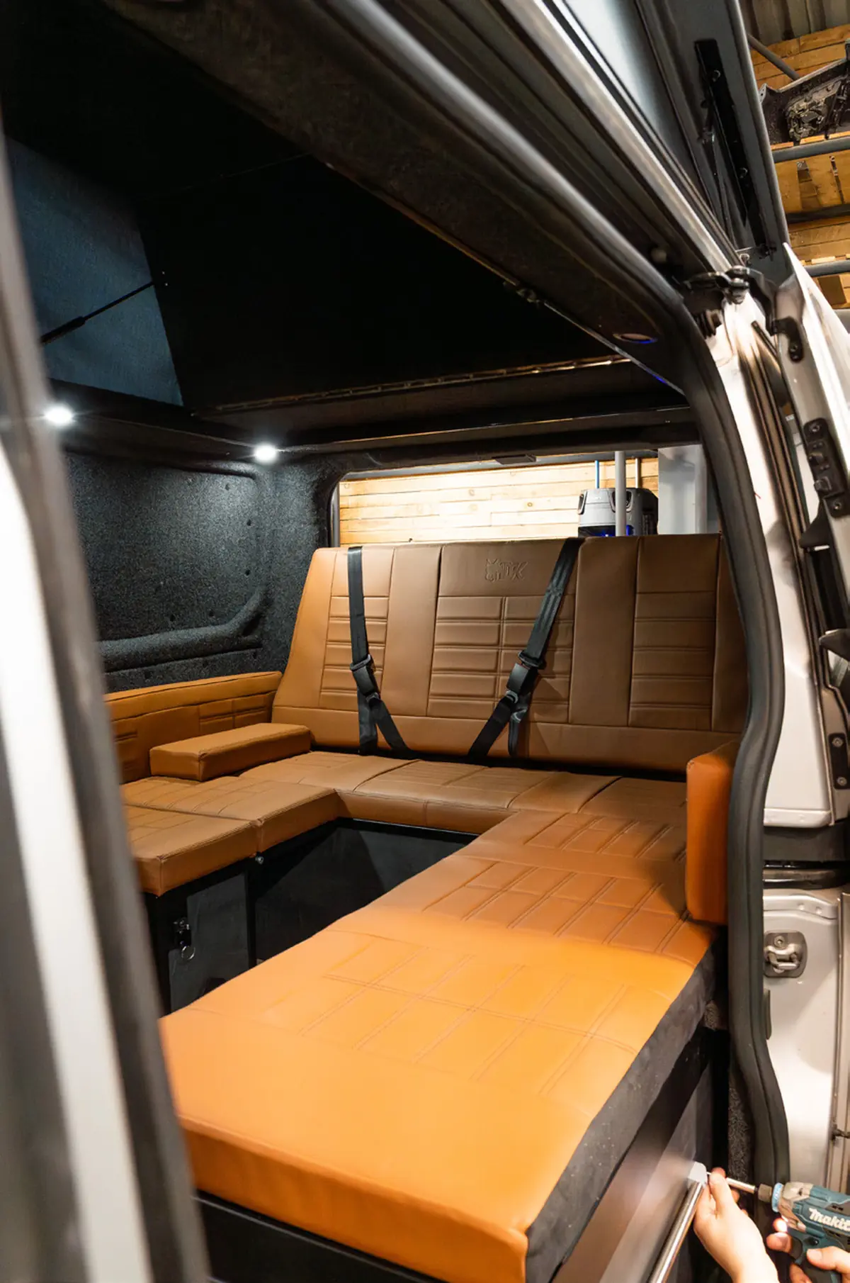 Ford Transit Custom camper interior with tan leather bench