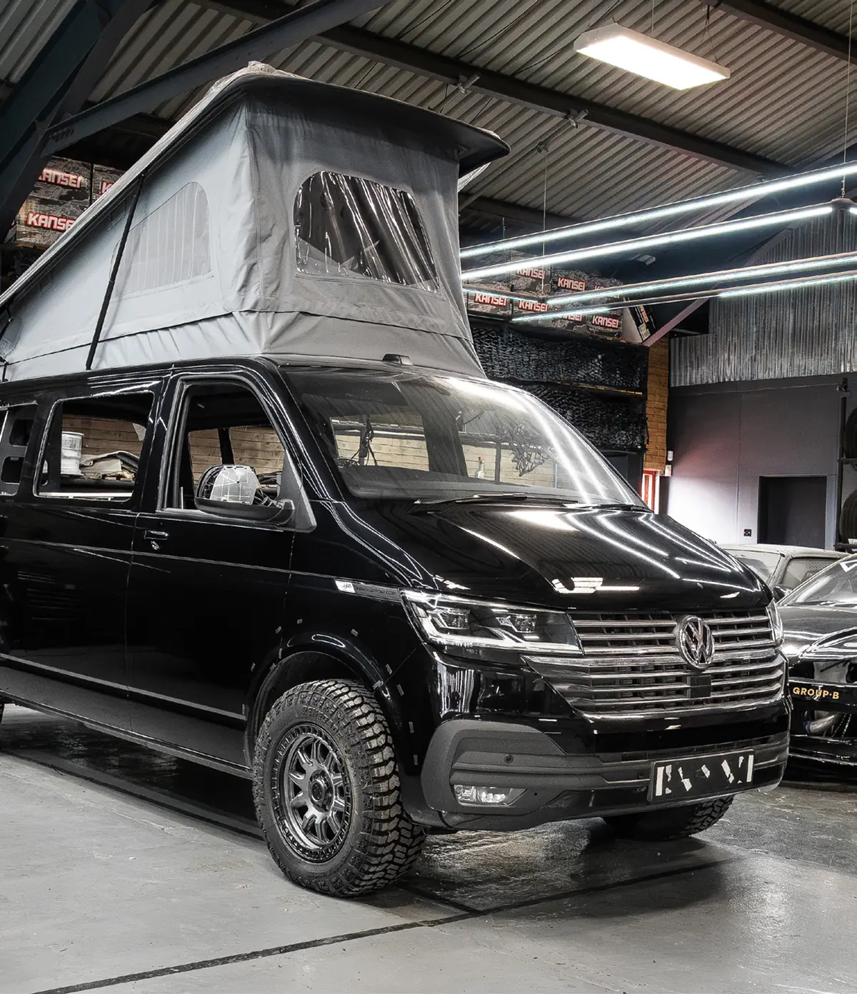 Black VW Transporter T6.1 with pop top roof conversion